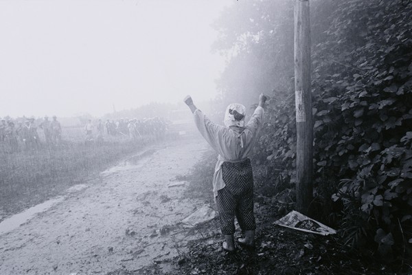 ⓒ Kazuo Kitai, Sanrizuka, Old Lady Faces the Water Cannon, Gelatin Silver Print, 25.8×38cm, 1970.jpg